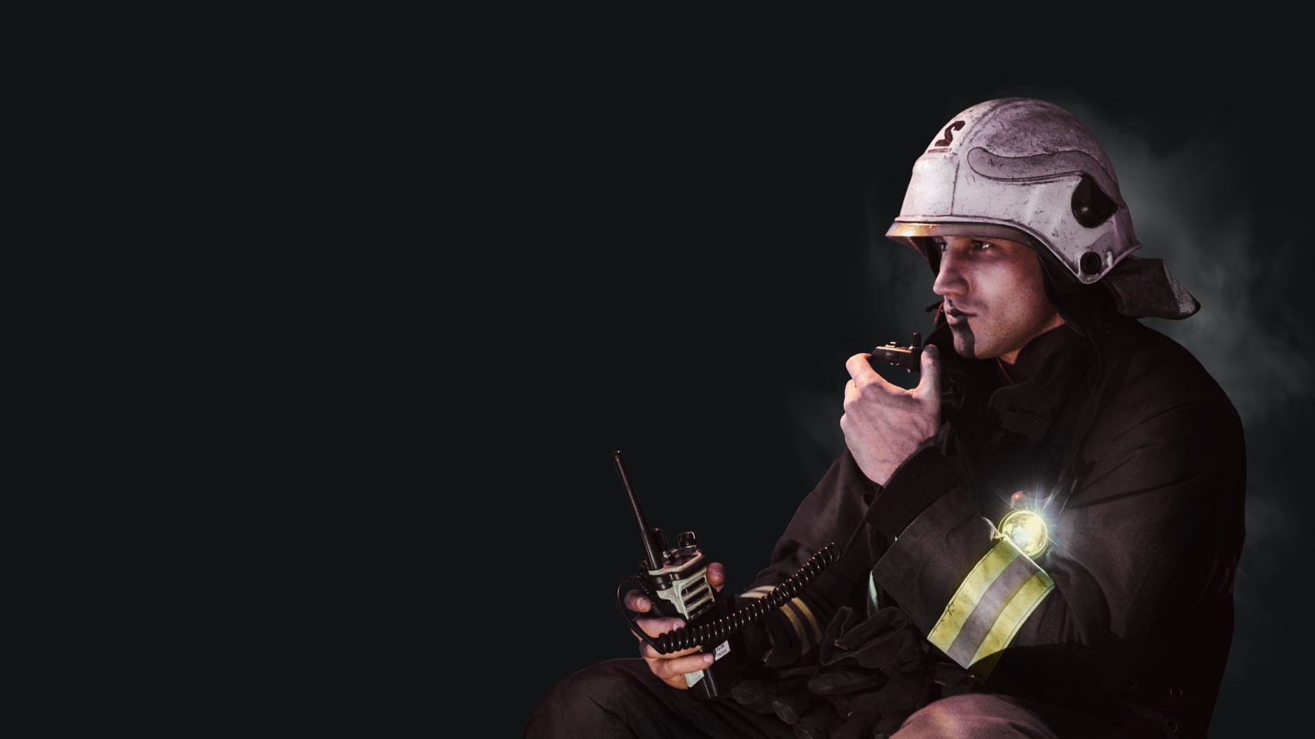 Firefighter communicating via radiostation